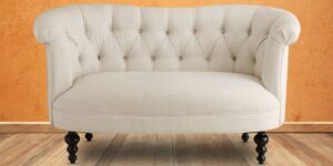 Enchanted Two Seater Chesterfield Sofa In Light Beige Colour